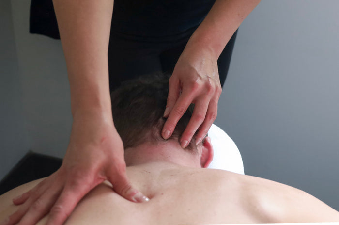 Person receiving a back massage