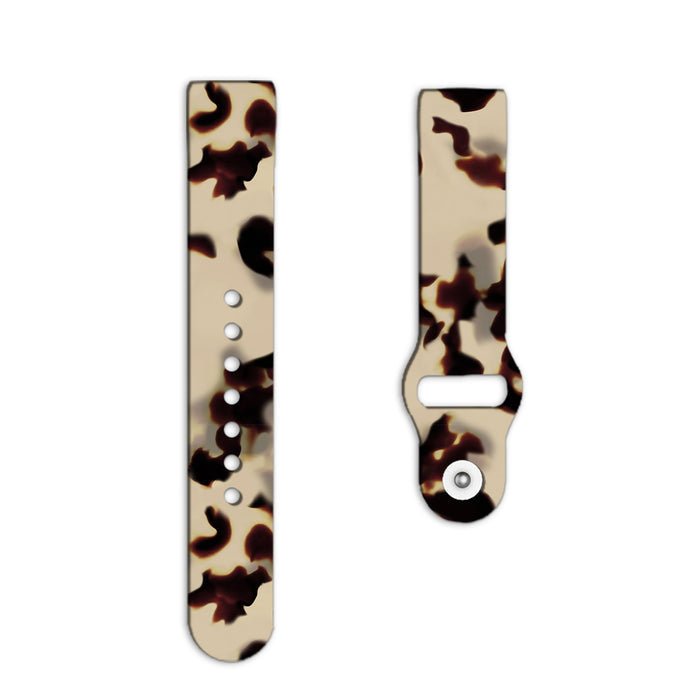 Coconut Lane Fitbit strap in ivory with a beige and dark brown tortoiseshell pattern.