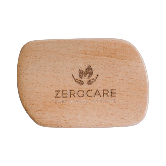 Lightweight detangler brush made from FSC-certified bamboo and natural rubber.