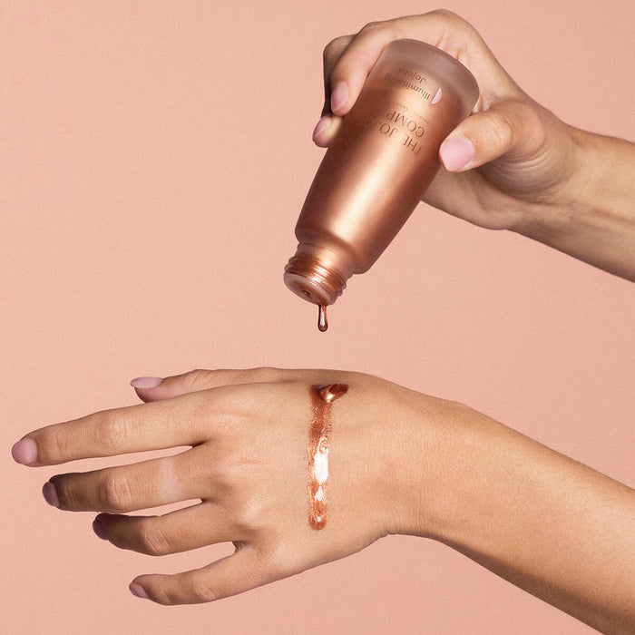 Hand pouring The Jojoba Company Illuminating Jojoba.